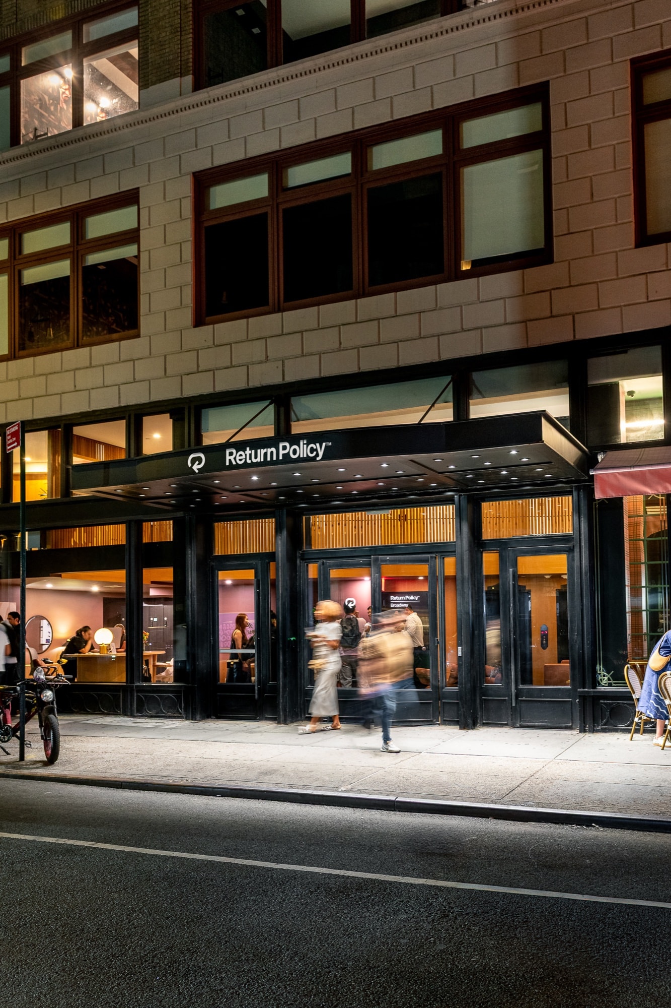 The Broadway Hotel storefront at night
