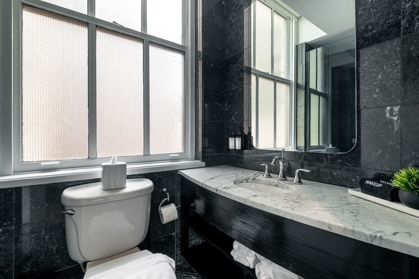 Room 1008, black marble bathroom